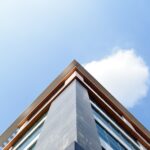 blue and white concrete building under blue sky during daytime