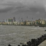 A large body of water with a city in the background