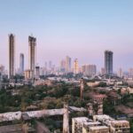 city skyline under blue sky during daytime