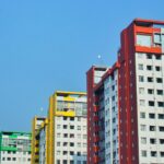 a row of multicolored buildings in a city